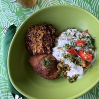 Akar Cafe - Indian chickpea, eggplant and spinach curry with red rice and samosa at Akar Cafe in Lovina