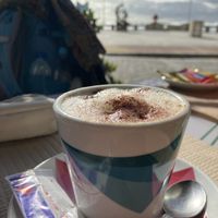 Cappuccino mit Hafermilch  at Café Oceano in Vila Praia De Ancora