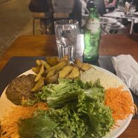 Lentil burger, fries, rice, salad  at Café Oceano in Vila Praia De Ancora