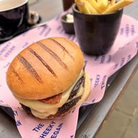 Double bakon burger with chips  at The Cheeky Vegan in Exeter