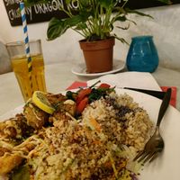 Vegan Plate ("chicken" crisps, stirfry, rice, salad) with unsweetened iced tea. at TerraZen Centre in Amsterdam