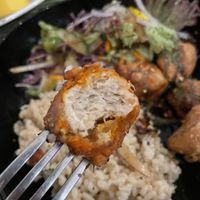 Karage don buri: bowl with brown rice, salad and marinated vegan chicken.  at TerraZen Centre in Amsterdam
