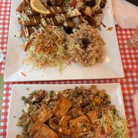 Plate with sausage and bacon, and fried rice with tofu (spicy requested)  at TerraZen Centre in Amsterdam
