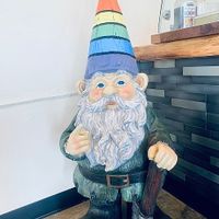 Cute gnome mascot with a rainbow cap at Cup & Crêpe in Everett