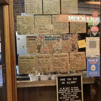 Flavour options on the wall outside. Vegan ones are at the top/right   at Rollickin Gelato Cafe in Christchurch