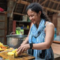 Volunteer prepping food at Sadhana Forest Seva Kitchen in Auroville