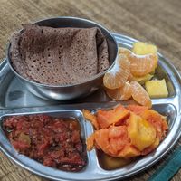 Pancakes with jam and fruits at Sadhana Forest Seva Kitchen in Auroville
