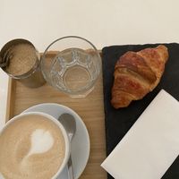 dirty chai latte and croissant   at Robert Capa Café in Budapest
