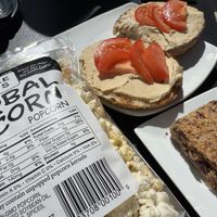 Little lad’s herbal corn, hummus bagel and "granola bar”  at Elements: Books Coffee Beer in Biddeford
