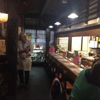 Chef talking to customers on low table and chairs  at Heianraku in Takayama