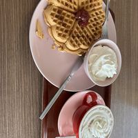 Waffles cream and strawberry jam with creamy hot cocoa   at Valkyrjan Bistro & Bar in Reykjavik