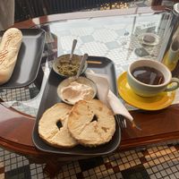 ham and cheese croissant, bagel with pesto and cream cheese, french press coffee  at Valkyrjan Bistro & Bar in Reykjavik