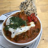 Crazy yummy, bright curry dish with fresh veggies and just enough spice  at EmmaPea Vegan Food and Bar in Berlin