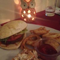 Black Bean Burger with onions rings and a sweet potato salad with a ginger cumin dressing at AVA Restaurant and Wine Bar in Staunton