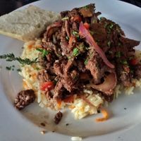 Seitan in ";beefy"; sauce with mushrooms and veggies on rice pilaf.  at Crane and Pelican in Le Claire