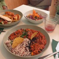 Chilli tofu with rice. Jackfruit with roasted potatoes and salad. at  Vegigan in Tenerife