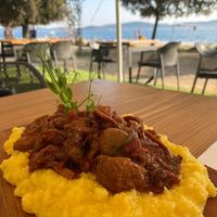Polenta with tomatoes, mushrooms, olives and figs sauce. at The Botanist in Zadar