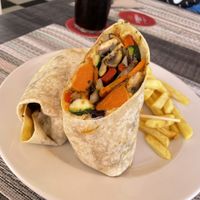 Awesome Roasted vegetables and hummus wrap with chips  at Smith's Restaurant Café Bar in Mallorca