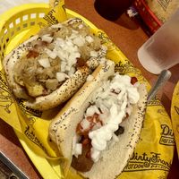 The real man and Razzle dazzle   at Dirty Franks Hot Dog Palace in Columbus