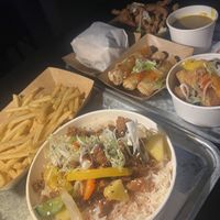 Sweet and sour bowl, spring rolls, popcorn tofu, original wings, chicken burger, chips and curry sauce   at Forked Up Vegan Kitchen - Blackstock Market in Liverpool