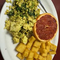 Vegan tofu scramble, polenta and grilled grapefruit   at The Country Corner Cafe in Saratoga Springs