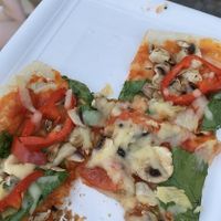 Half eaten vegetable pizza with vegan cheese😄 at Turtle Pizza in Berlin