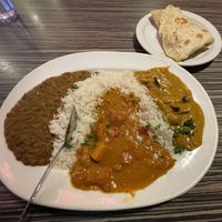 Coconut curried lentils, chickpea bebere stew, and tofu curry- with rice and roti  at Jambo Cafe in Santa Fe