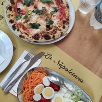Vegetarian pizza and vegetarian salad at La Napoletana in Taormina