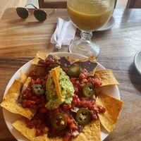 Nachos with a mango juice   at Rainbow Cafe in Antigua