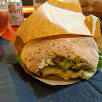 the vegan sandwich and a can of red spritz at Ribelle in Assisi