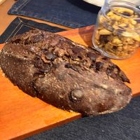 Pão na chapa de sourdough cacau 70% com gostas de chocolate e manteiga de macadâmia  at Inari in Rio De Janeiro