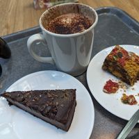 Healthy lunch. Vegan Clementine chocolate torte. Pistachio pomegranate thingy. Hot chocolate. at Levels Café and Lounge in Edinburgh