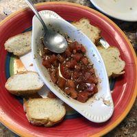 Half eaten balsamic bruschetta with daiya cheese, fresh tomatoes at Vertoris Pizza House in Bradenton