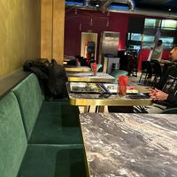 Kitchen in background   at Saravanaa Bhavan in Cologne