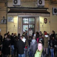 People waiting to get in to Pizzeria da Michele. at Pizzeria da Michele in Naples