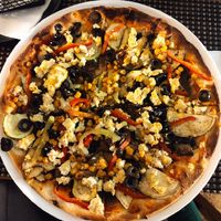 Pizza with smoked tofu 3/5 at Restaurant Bon Appetit in Campina