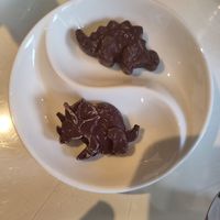 Chocolat dinos for the hot chocolat 💚 and as surprise at the end at The Drawing Rooms in South West London