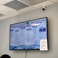 Menu and a sign saying out of vegan mayo  at Pacific Bowl & Rolls in Monterey