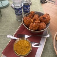 Crispy Cauliflower Bites Curry Hummus   at Wirtshaus am Bavariapark in Munich