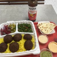 Falafel plate with pickled vegetables and three sauces.   at Shawarma Shack Mediterranean Grill in San Diego