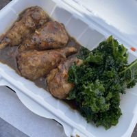 Jerk chicken drummies and kale salad   at Zoe's Vegan Delight  in Washington
