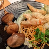 Teriyaki mushroom skewer on the left, salt & pepper vegan shrimp on the right at OPLANTE Vegan Sushi & Wok  in Montreal