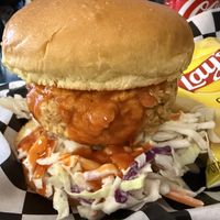 “Chicken” sandwich with buffalo sauce and cole slaw salad 🤩  at Not Ya Mama's Vegan Cafe in Salem