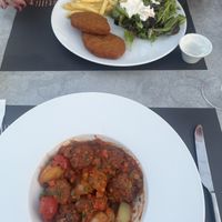 Chicken schnitzel and meatballs with new potatoes   at Mystilli Roof Garden in Rhodes