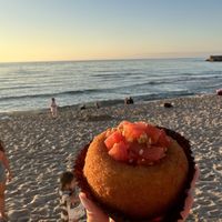 Topped with tomatoes   at Sfrigola in Cefalu