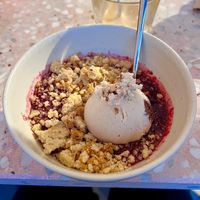 warm wild berry crumble with speculoos brownie ice cream 😋  at enila plant based ice cream in Basel