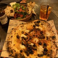 Vegan burrata salad and vegan squash pizza  at Retrogusto Experience in Lisbon