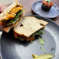 Pumpkin sandwich 🥪 it’s good + the Halloween themed cupcake    at Scullin Sweet Bones in Belconnen