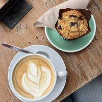 Café latte with oat milk and vegan blueberry muffin   at Shoukâ in Chamonix-mont-blanc