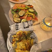 Pa amb oli bread with grilled veg and rosemary potatoes. Olives and bread in the background.  at Cristal in Mallorca